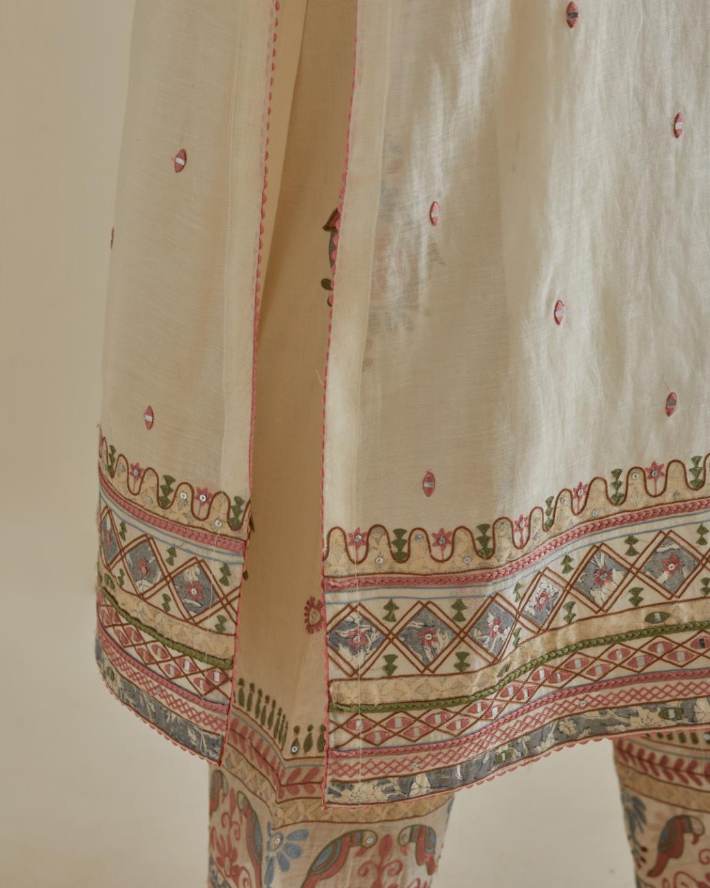 Pink and off-white cotton chanderi straight kurta set with yoke with patchwork and silk thread embroidery highlighted with mirror, sequins, tassels and braids.