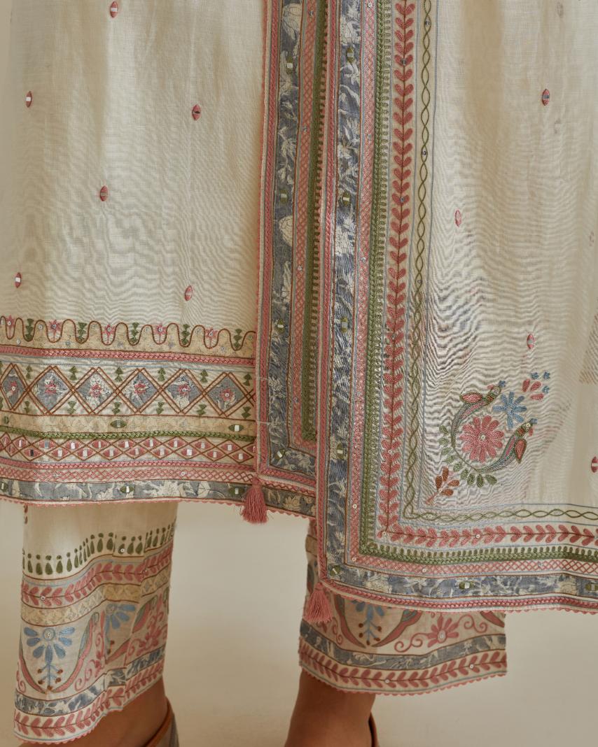 Pink and off-white cotton chanderi straight kurta set with yoke with patchwork and silk thread embroidery highlighted with mirror, sequins, tassels and braids.