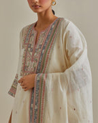 Pink and off-white cotton chanderi straight kurta set with yoke with patchwork and silk thread embroidery highlighted with mirror, sequins, tassels and braids.