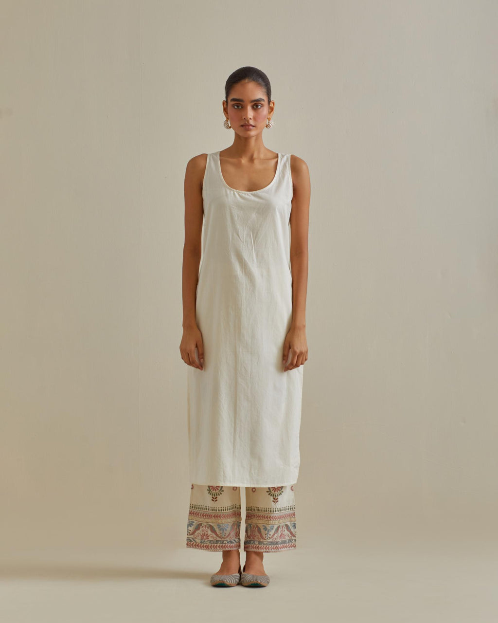 Pink and off-white cotton chanderi straight kurta set with all over chevron pattern. It is embellished with silk patchwork, thread, sequins and mirrors.