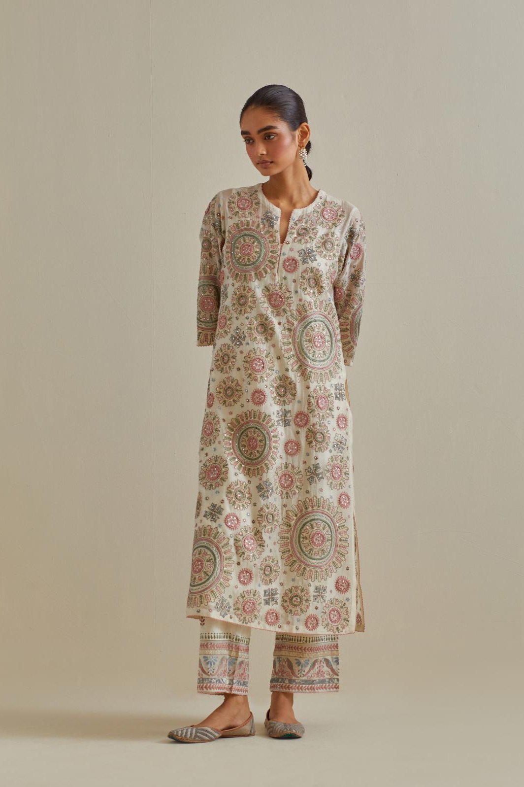 Pink and off-white cotton chanderi straight kurta set with all over patchwork, silk thread, mirror, tassels and sequins embroidery.