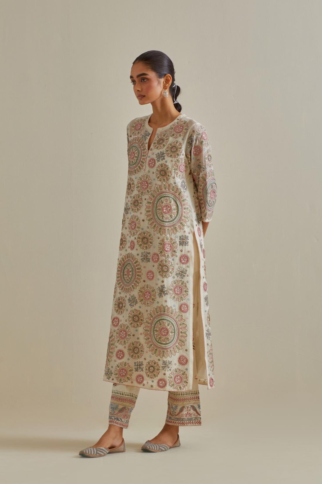 Pink and off-white cotton chanderi straight kurta set with all over patchwork, silk thread, mirror, tassels and sequins embroidery.