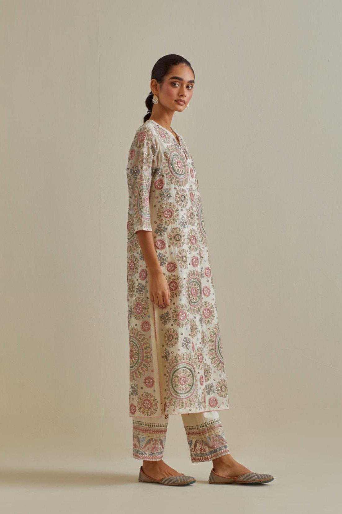 Pink and off-white cotton chanderi straight kurta set with all over patchwork, silk thread, mirror, tassels and sequins embroidery.