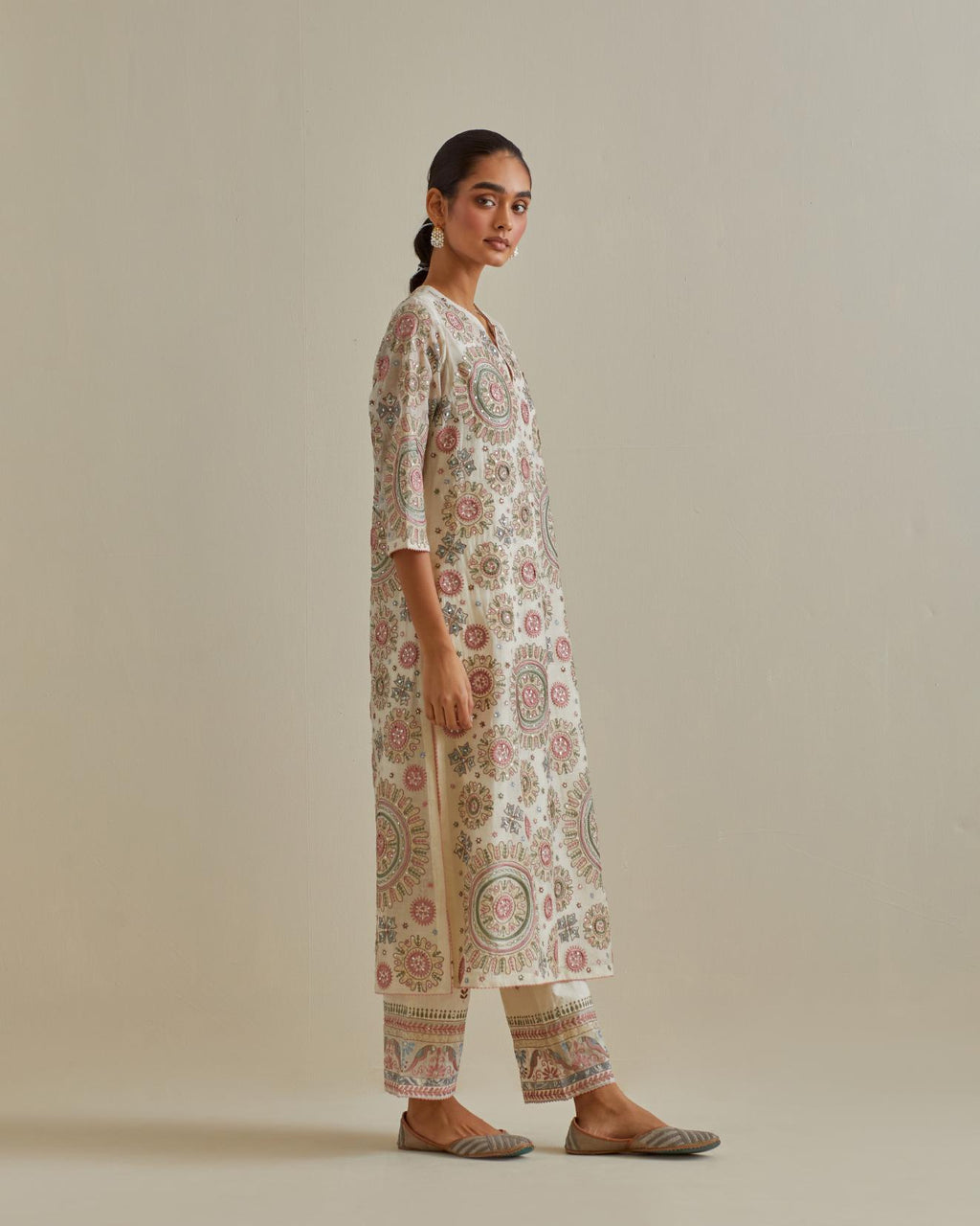 Pink and off-white cotton chanderi straight kurta set with all over patchwork, silk thread, mirror, tassels and sequins embroidery.