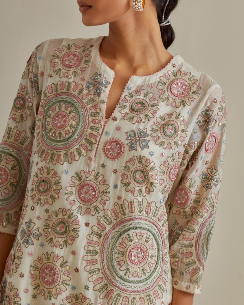 Pink and off-white cotton chanderi straight kurta set with all over patchwork, silk thread, mirror, tassels and sequins embroidery.