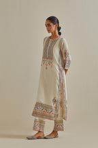 Pink and off-white cotton chanderi straight kurta set with yoke with patchwork and silk thread embroidery highlighted with mirror, sequins, tassels and braids.