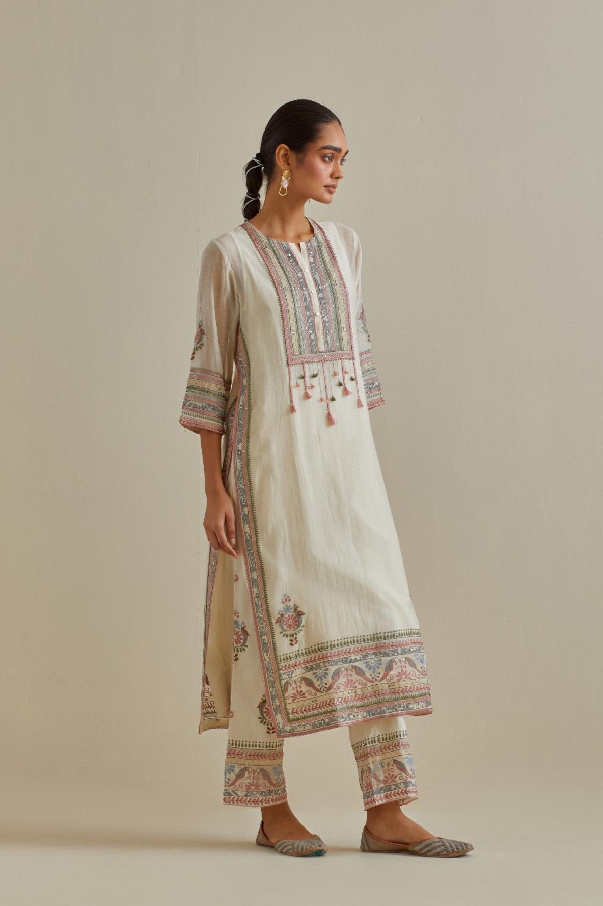 Pink and off-white cotton chanderi straight kurta set with yoke with patchwork and silk thread embroidery highlighted with mirror, sequins, tassels and braids.