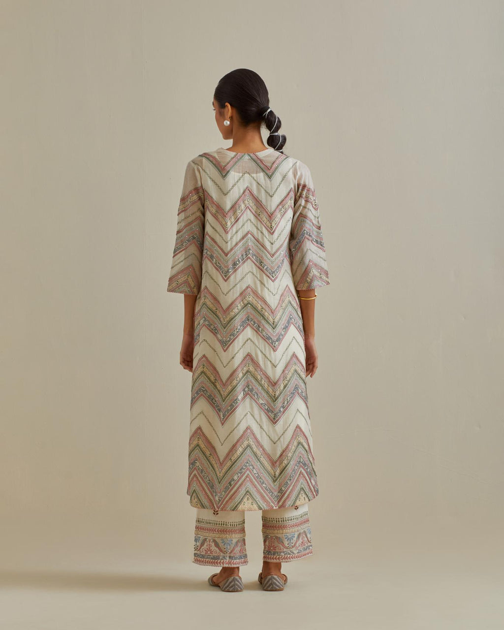 Pink and off-white cotton chanderi straight kurta set with all over chevron pattern. It is embellished with silk patchwork, thread, sequins and mirrors.