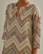 Pink and off-white cotton chanderi straight kurta set with all over chevron pattern. It is embellished with silk patchwork, thread, sequins and mirrors.
