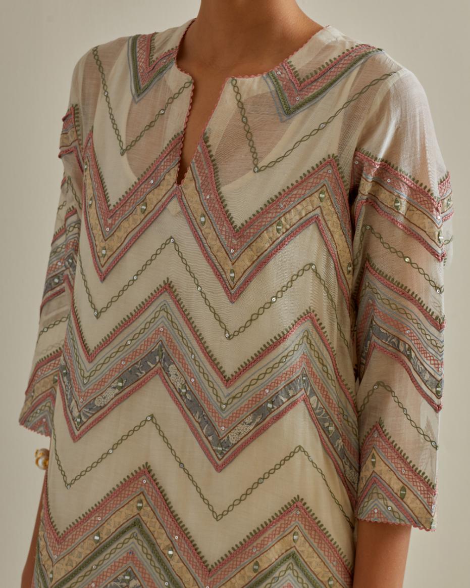 Pink and off-white cotton chanderi straight kurta set with all over chevron pattern. It is embellished with silk patchwork, thread, sequins and mirrors.