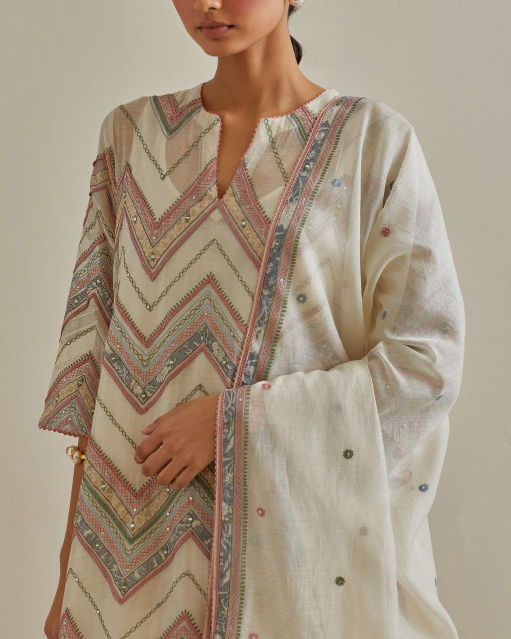 Pink and off-white cotton chanderi straight kurta set with all over chevron pattern. It is embellished with silk patchwork, thread, sequins and mirrors.