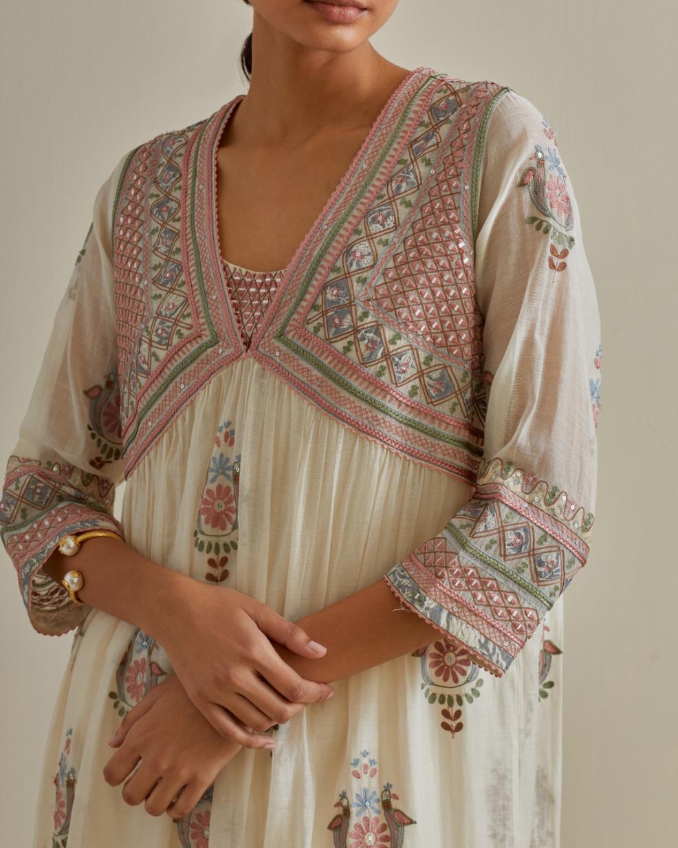 Pink and off-white cotton chanderi embroidered kurta dress set with V neck, yoke and fine gathers at empire line.