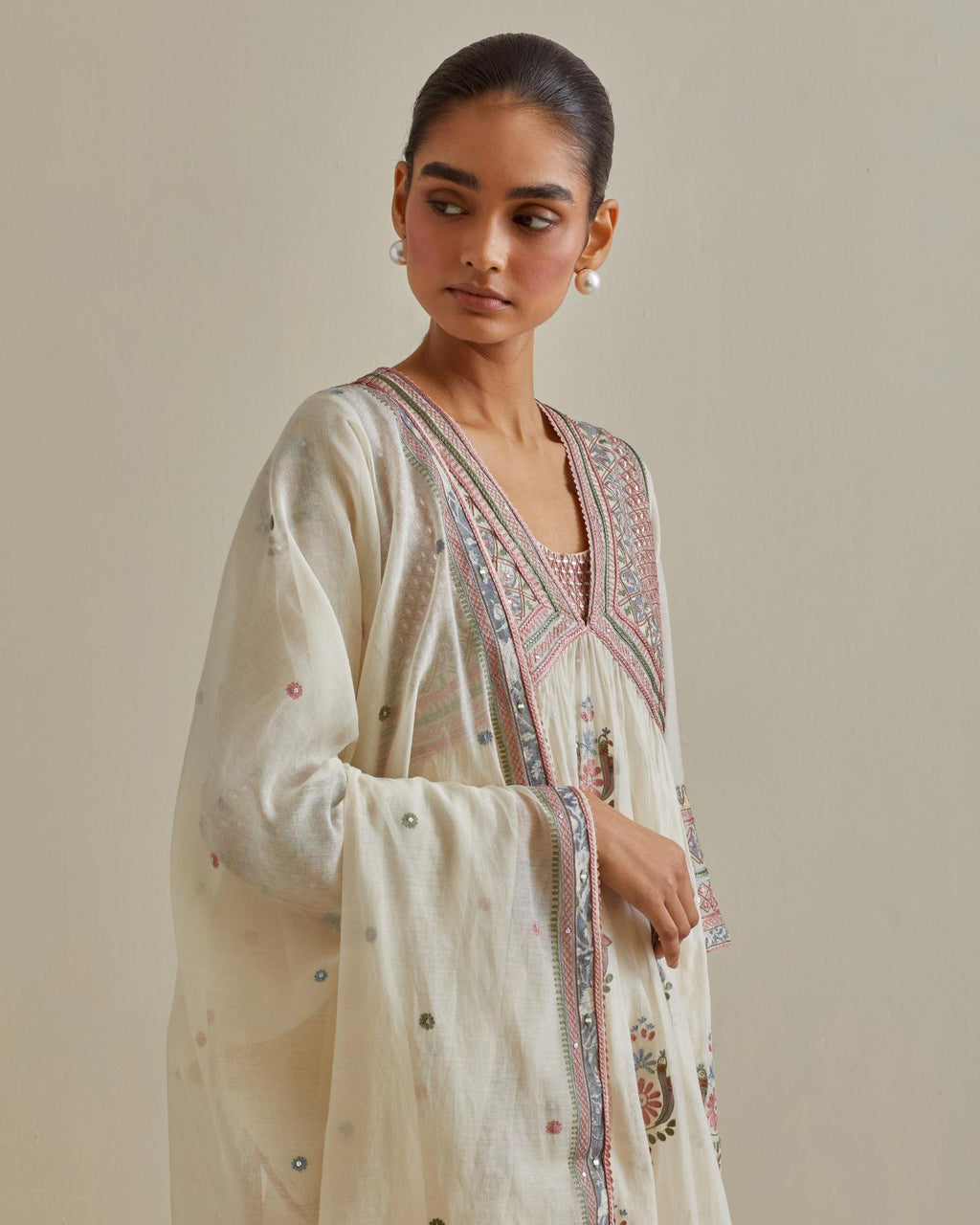 Pink and off-white cotton chanderi dupatta with delicate silk thread embroidery, highlighted with braids, mirrors and sequins work.