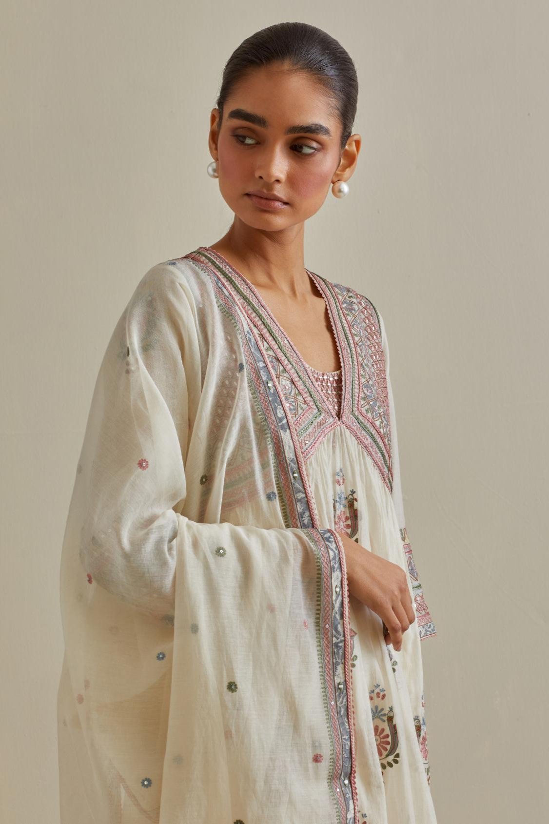 Pink and off-white cotton chanderi embroidered kurta dress set with V neck, yoke and fine gathers at empire line.