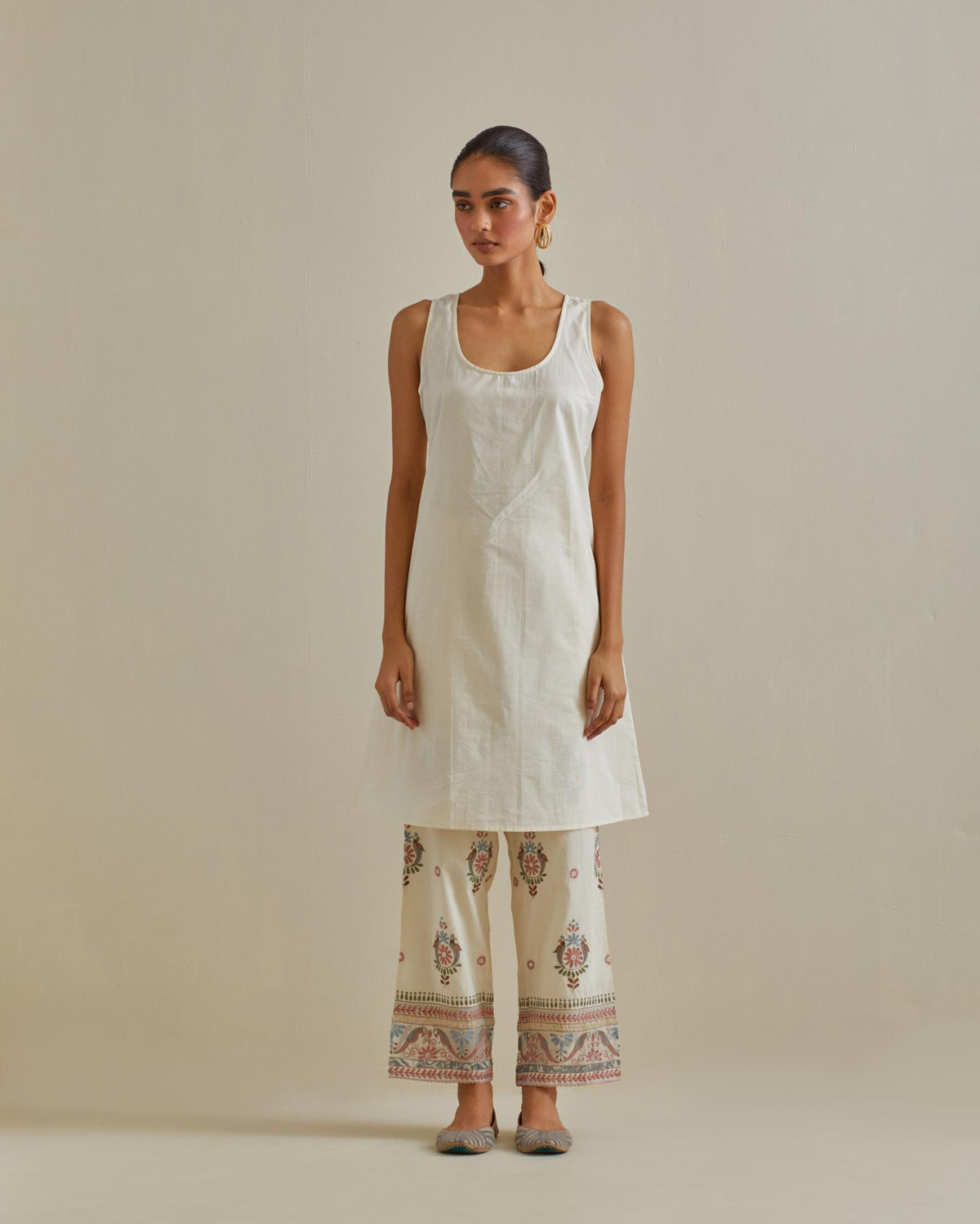 Pink and off-white cotton chanderi A-line kurta set with all over embroidery set in bold chevron stripes.