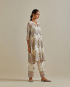 Pink and off-white cotton chanderi A-line kurta set with all over embroidery set in bold chevron stripes.
