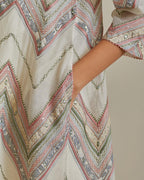 Pink and off-white cotton chanderi A-line kurta set with all over embroidery set in bold chevron stripes.