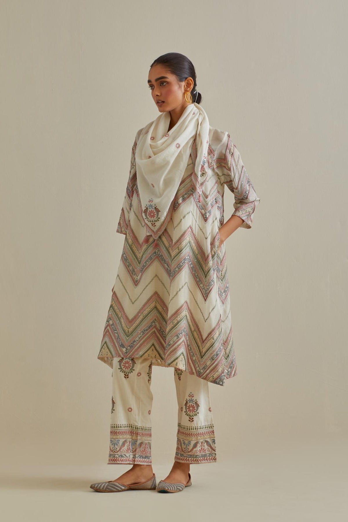Pink and off-white cotton chanderi A-line kurta set with all over embroidery set in bold chevron stripes.