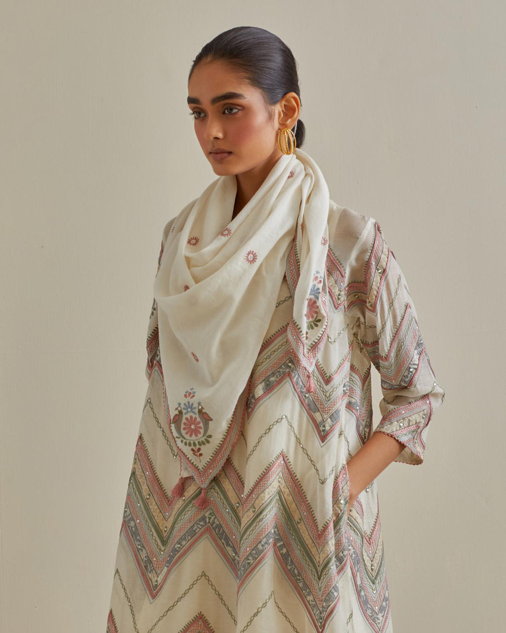 Pink and off-white cotton chanderi A-line kurta set with all over embroidery set in bold chevron stripes.