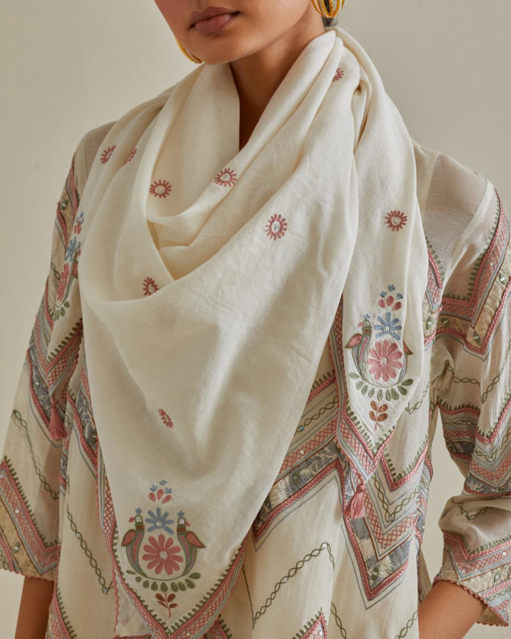 Pink and off-white cotton chanderi A-line kurta set with all over embroidery set in bold chevron stripes.