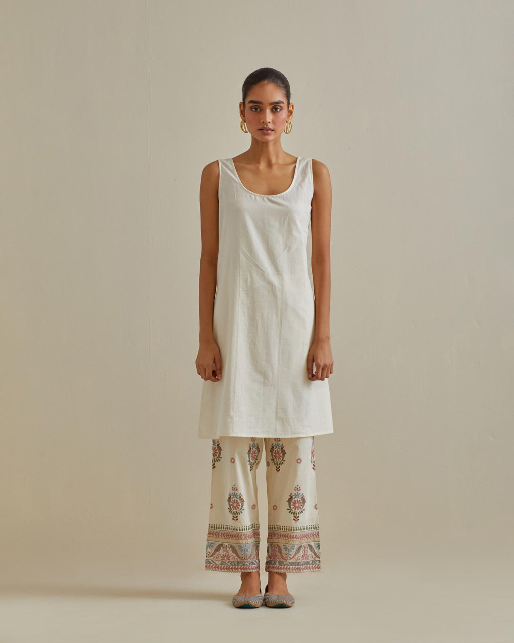 Pink and off-white A-line cotton chanderi kurta set with all over patchwork, silk thread, mirror, tassels and sequin embroidery.