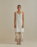 Pink and off-white A-line cotton chanderi kurta set with all over patchwork, silk thread, mirror, tassels and sequin embroidery.