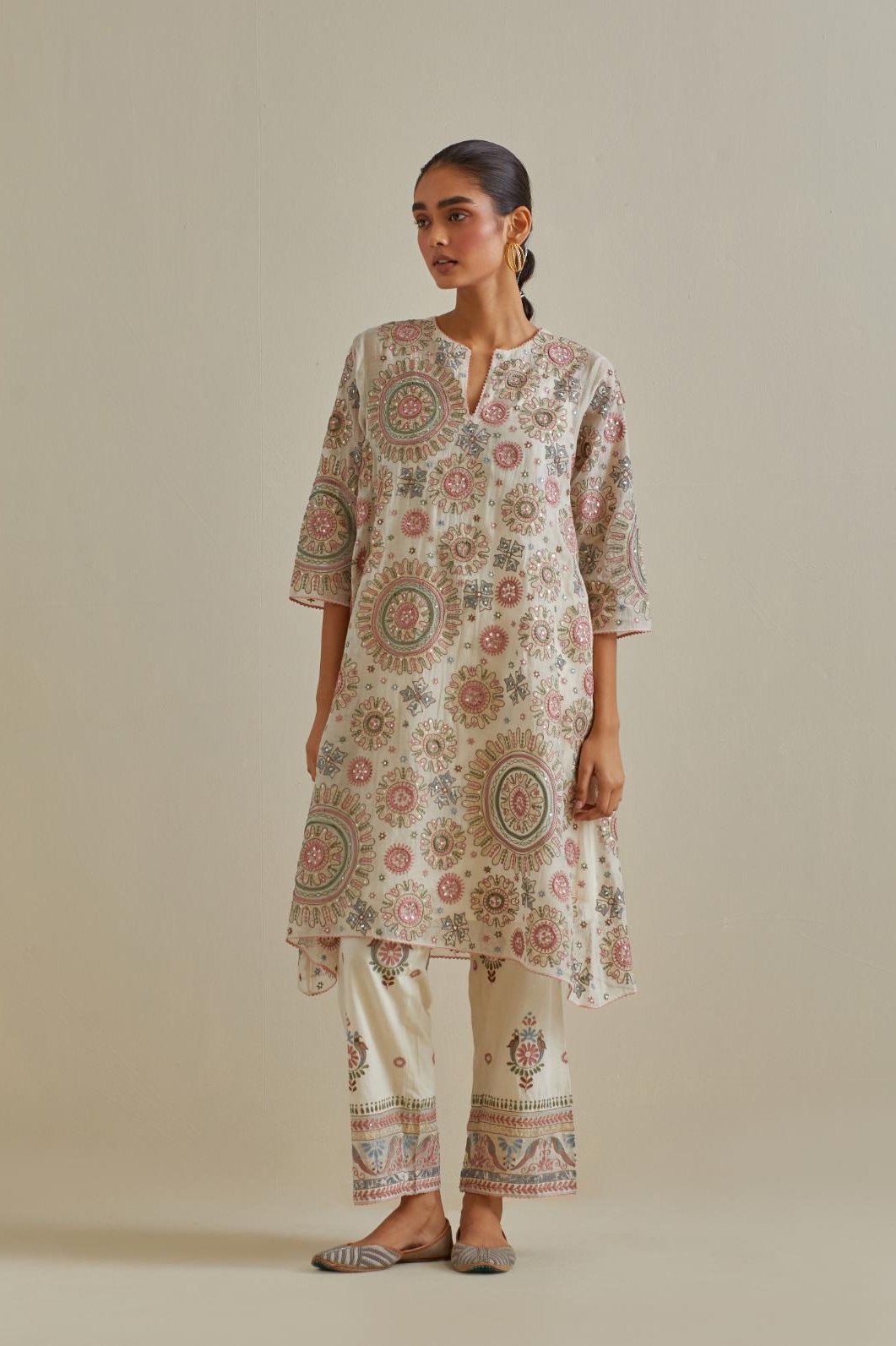 Pink and off-white A-line cotton chanderi kurta set with all over patchwork, silk thread, mirror, tassels and sequin embroidery.