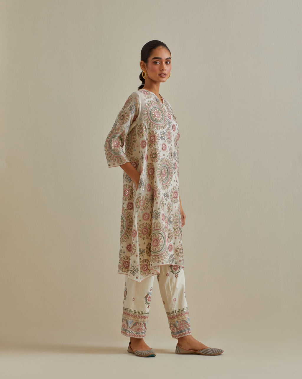 Pink and off-white A-line cotton chanderi kurta set with all over patchwork, silk thread, mirror, tassels and sequin embroidery.