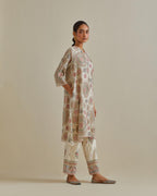 Pink and off-white A-line cotton chanderi kurta set with all over patchwork, silk thread, mirror, tassels and sequin embroidery.