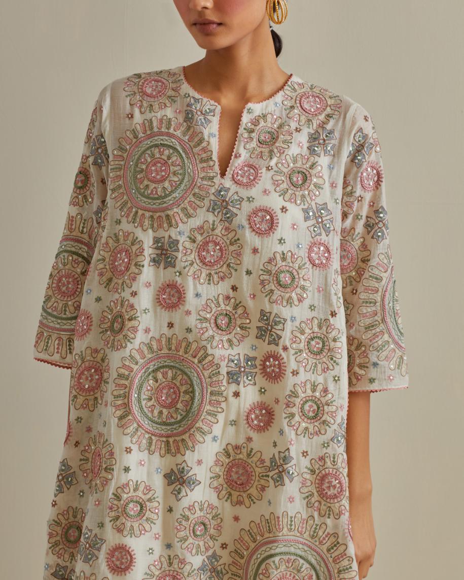 Pink and off-white A-line cotton chanderi kurta set with all over patchwork, silk thread, mirror, tassels and sequin embroidery.