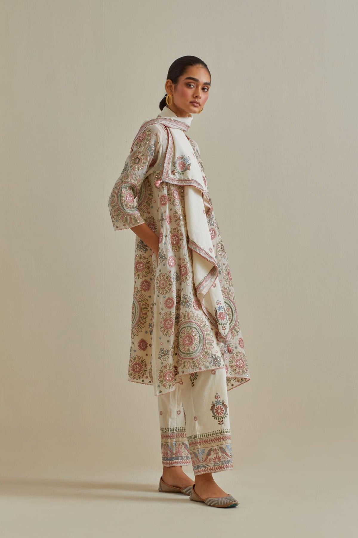 Pink and off-white A-line cotton chanderi kurta set with all over patchwork, silk thread, mirror, tassels and sequin embroidery.