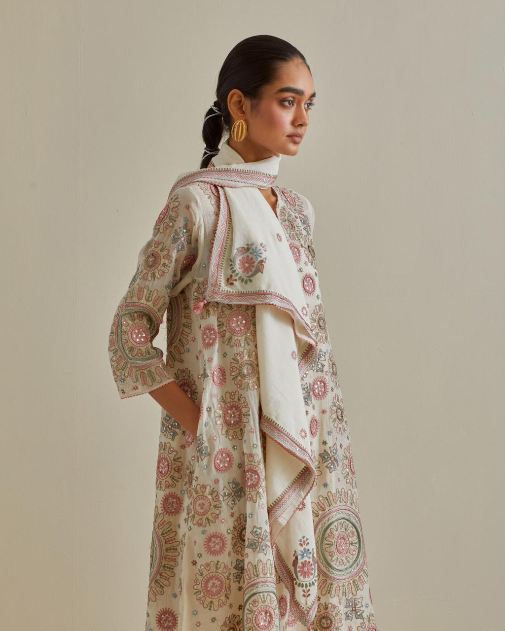 Pink and off-white A-line cotton chanderi kurta set with all over patchwork, silk thread, mirror, tassels and sequin embroidery.
