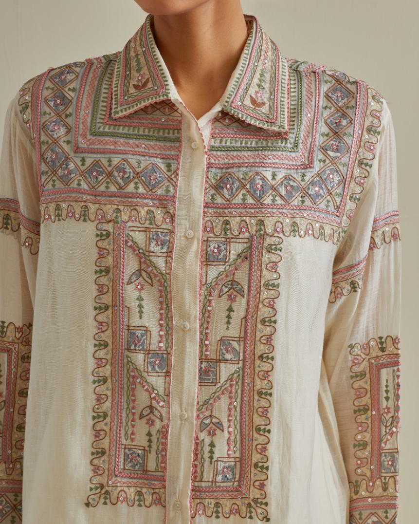Pink and off-white cotton chanderi embroidered shirt with full sleeves, paired with off white cotton straight pants with all over multi color embroidery detailed with sequins.