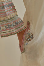Pink and off-white cotton chanderi easy fit long kaftan detailed with patch, silk thread, mirror & sequins work, paired with off white cotton straight pants with all over multi color embroidery detailed with sequins.
