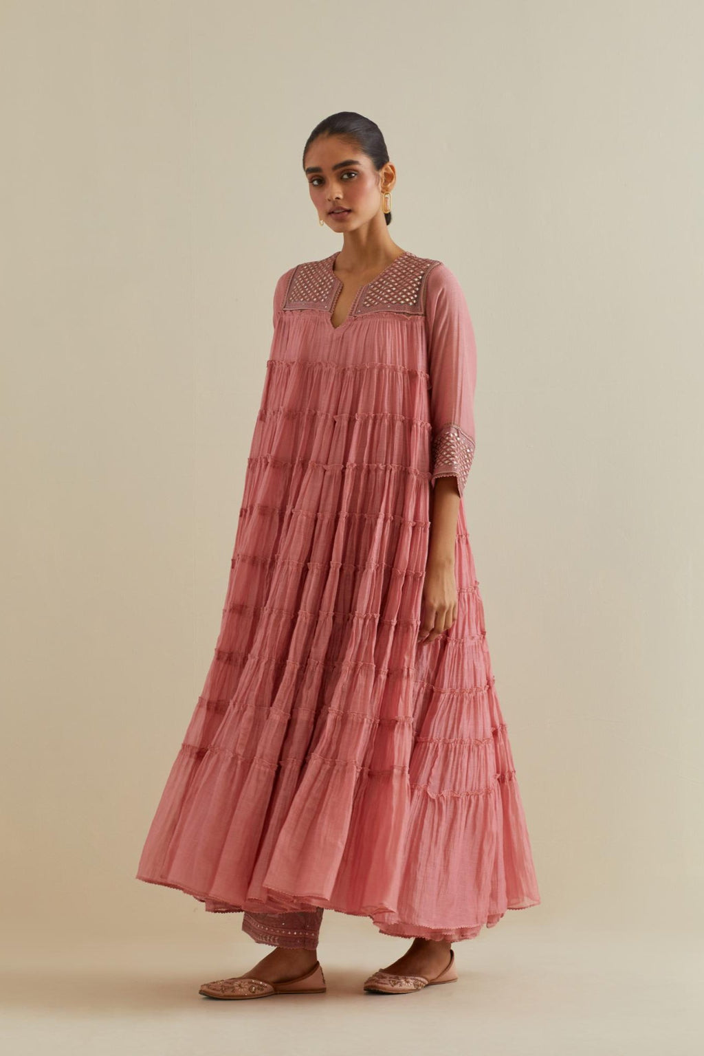 Pink cotton chanderi multi-tiered kurta dress set with 3/4 sleeves, highlighted with mirror work.