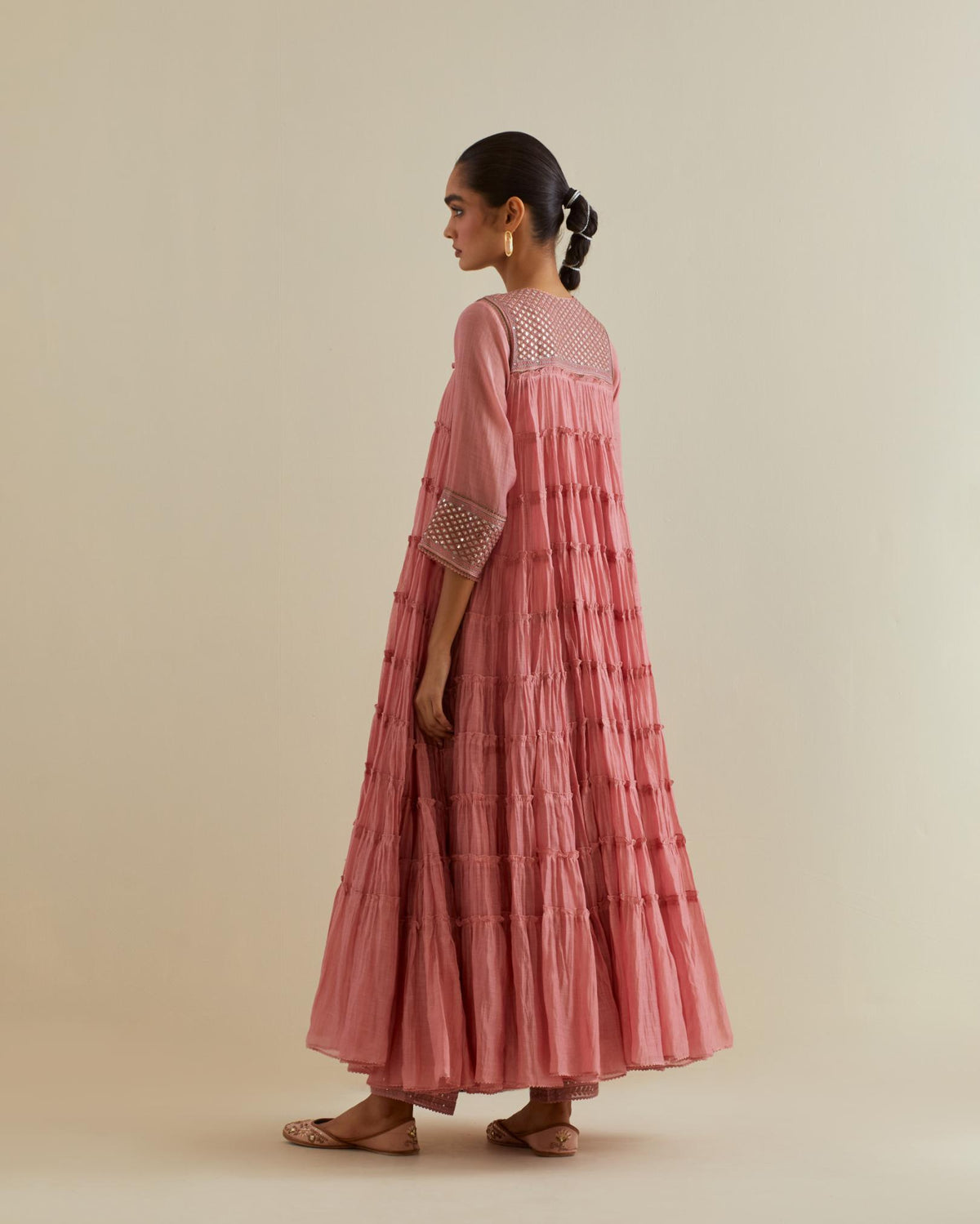 Pink cotton chanderi multi-tiered kurta dress set with 3/4 sleeves, highlighted with mirror work.