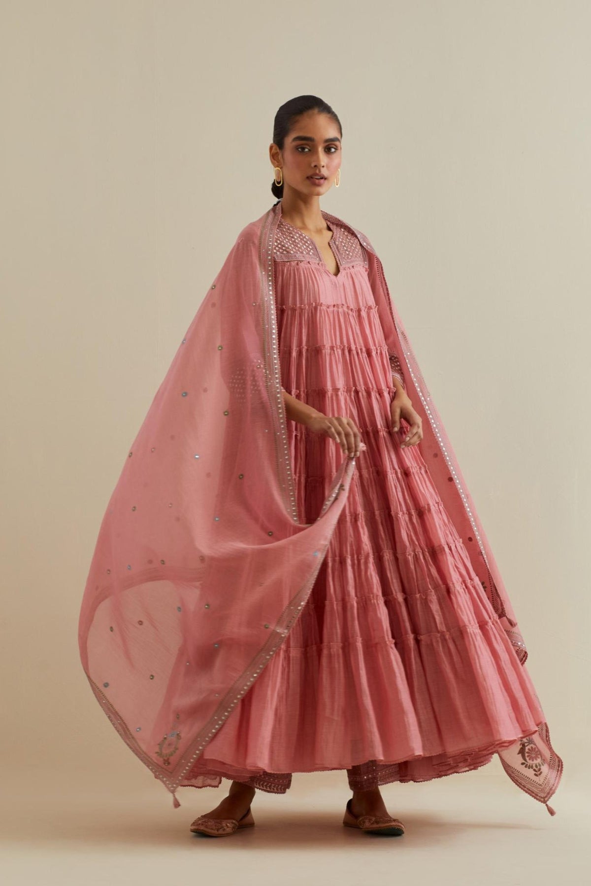 Pink cotton chanderi multi-tiered kurta dress set with 3/4 sleeves, highlighted with mirror work.