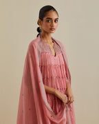 Pink cotton chanderi multi-tiered kurta dress set with 3/4 sleeves, highlighted with mirror work.