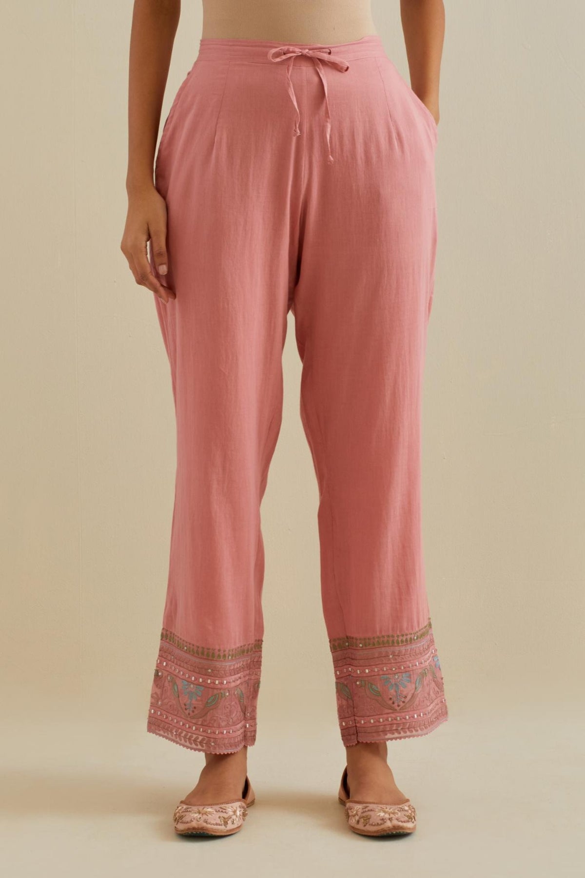 Pink straight pants with all over multi color embroidery detailed with sequins.