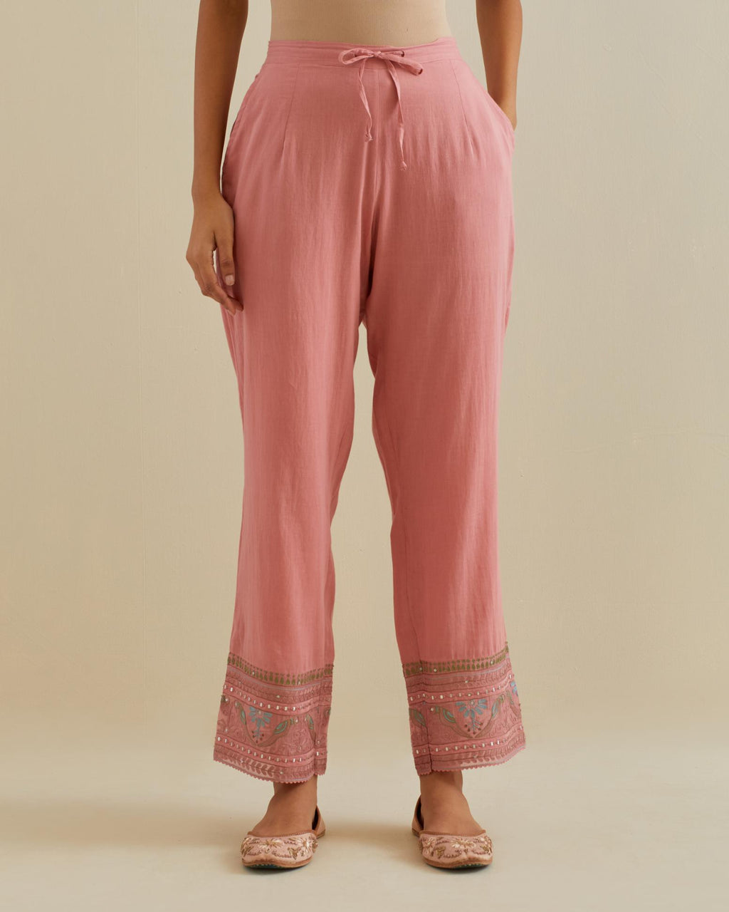 Pink straight pants with all over multi color embroidery detailed with sequins.