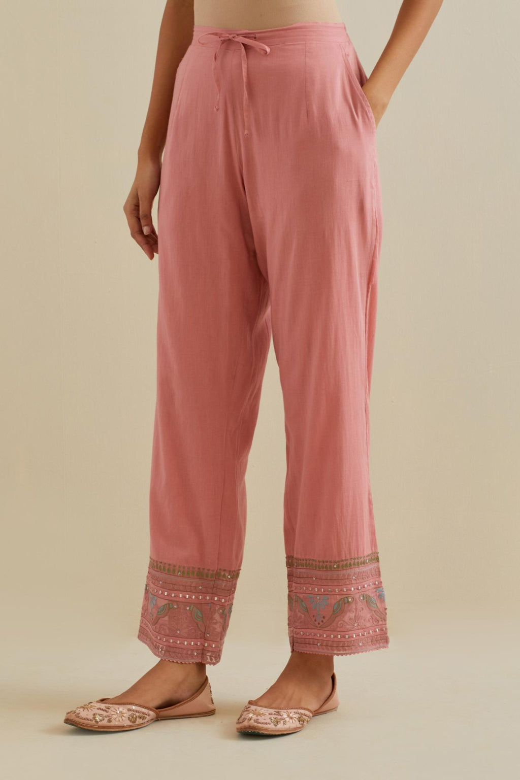 Pink straight pants with all over multi color embroidery detailed with sequins.