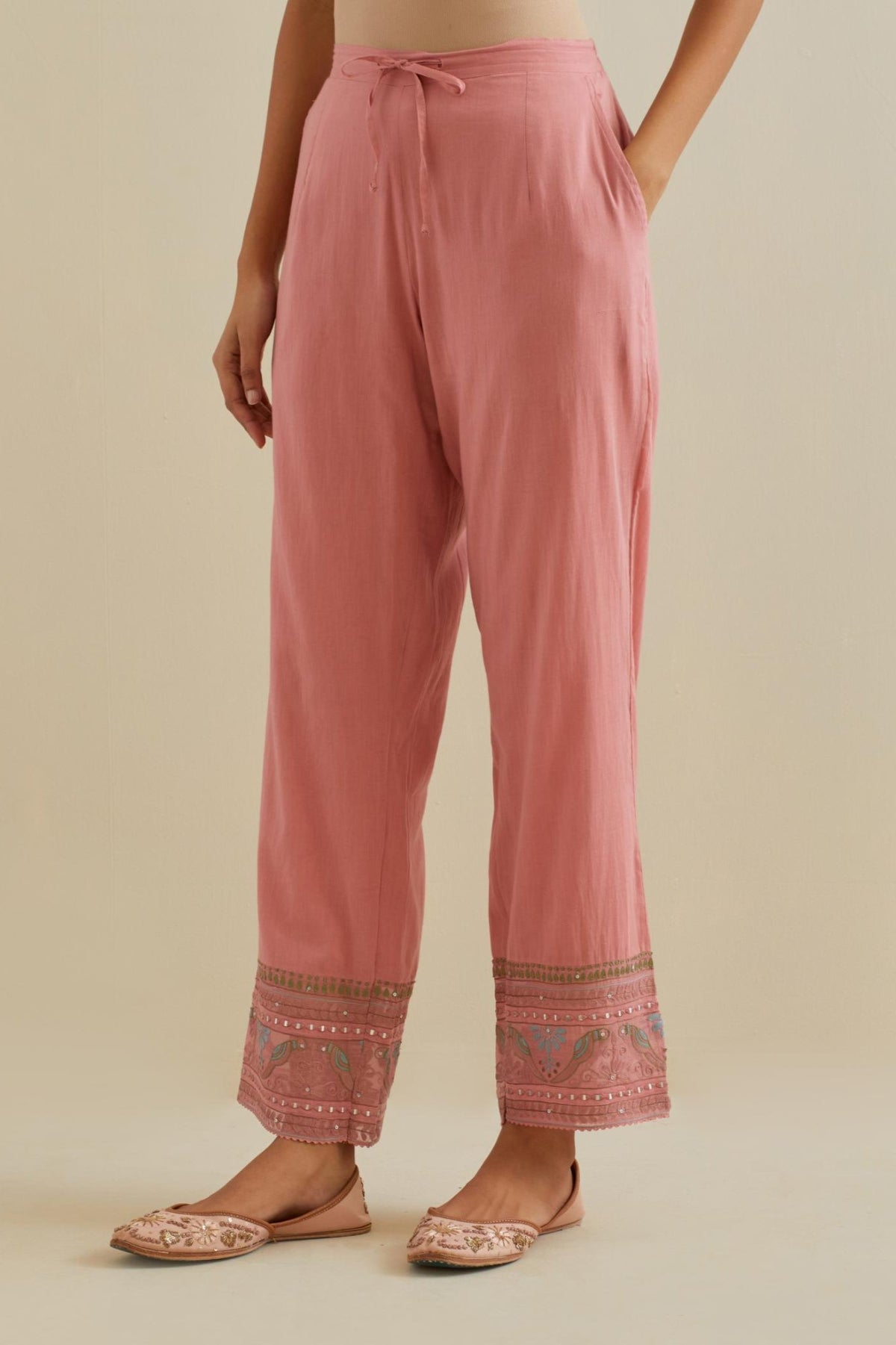 Pink straight pants with all over multi color embroidery detailed with sequins.