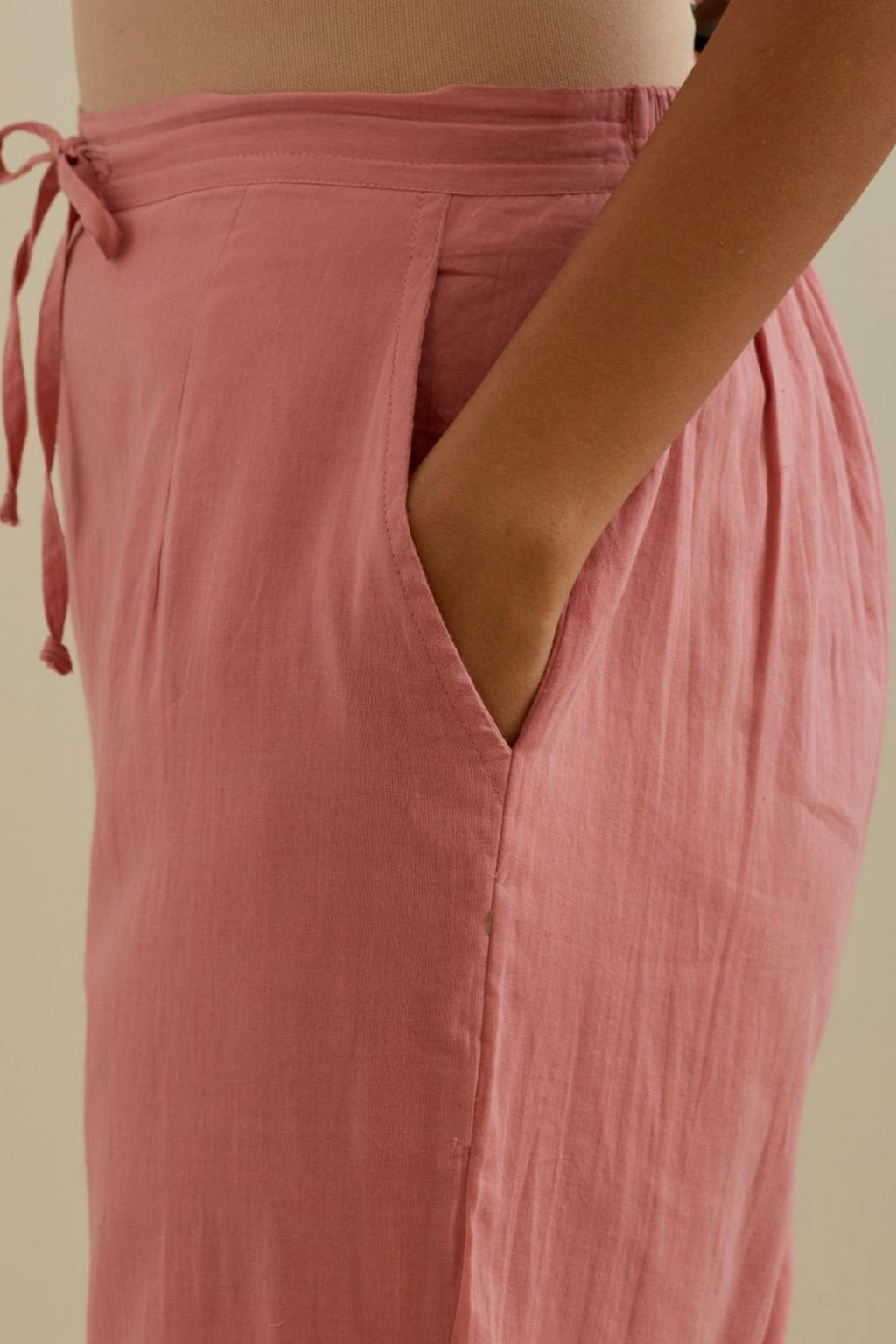 Pink straight pants with all over multi color embroidery detailed with sequins.