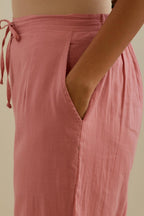 Pink straight pants with all over multi color embroidery detailed with sequins.