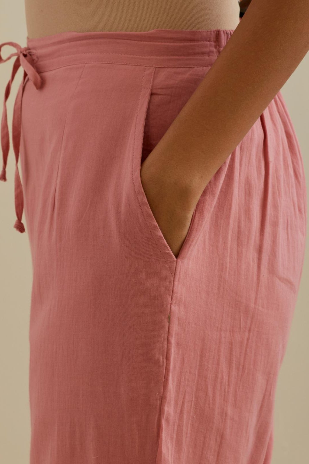 Pink straight pants with all over multi color embroidery detailed with sequins.