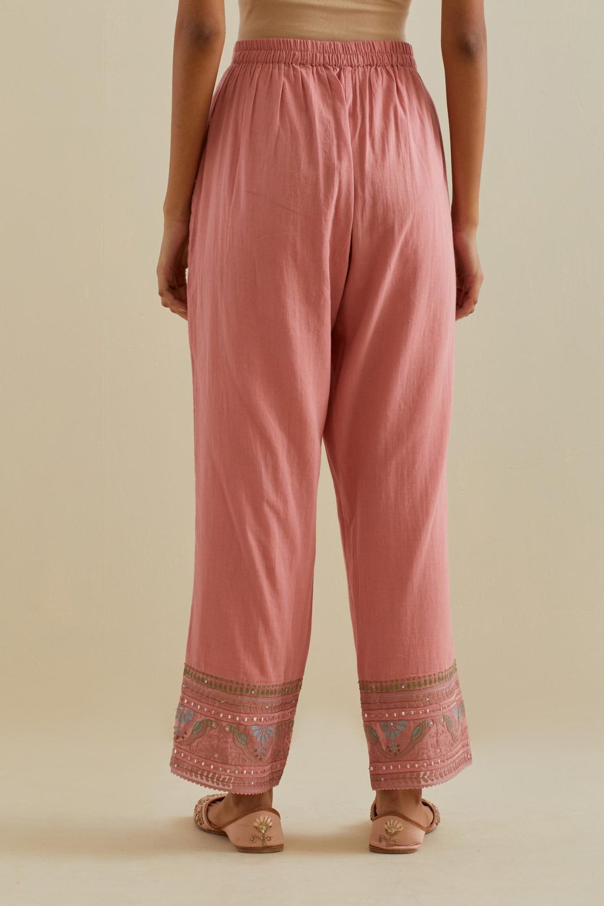 Pink straight pants with all over multi color embroidery detailed with sequins.