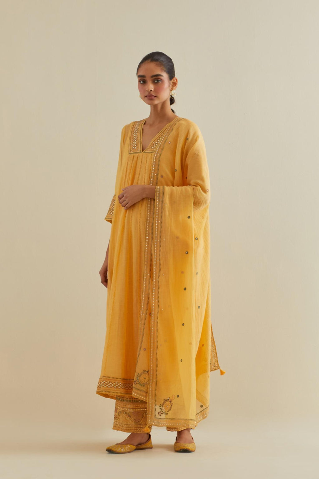 Yellow cotton chanderi kurta dress set with a V neck embroidered yoke and panels.