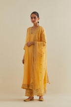 Yellow cotton chanderi kurta dress set with a V neck embroidered yoke and panels.