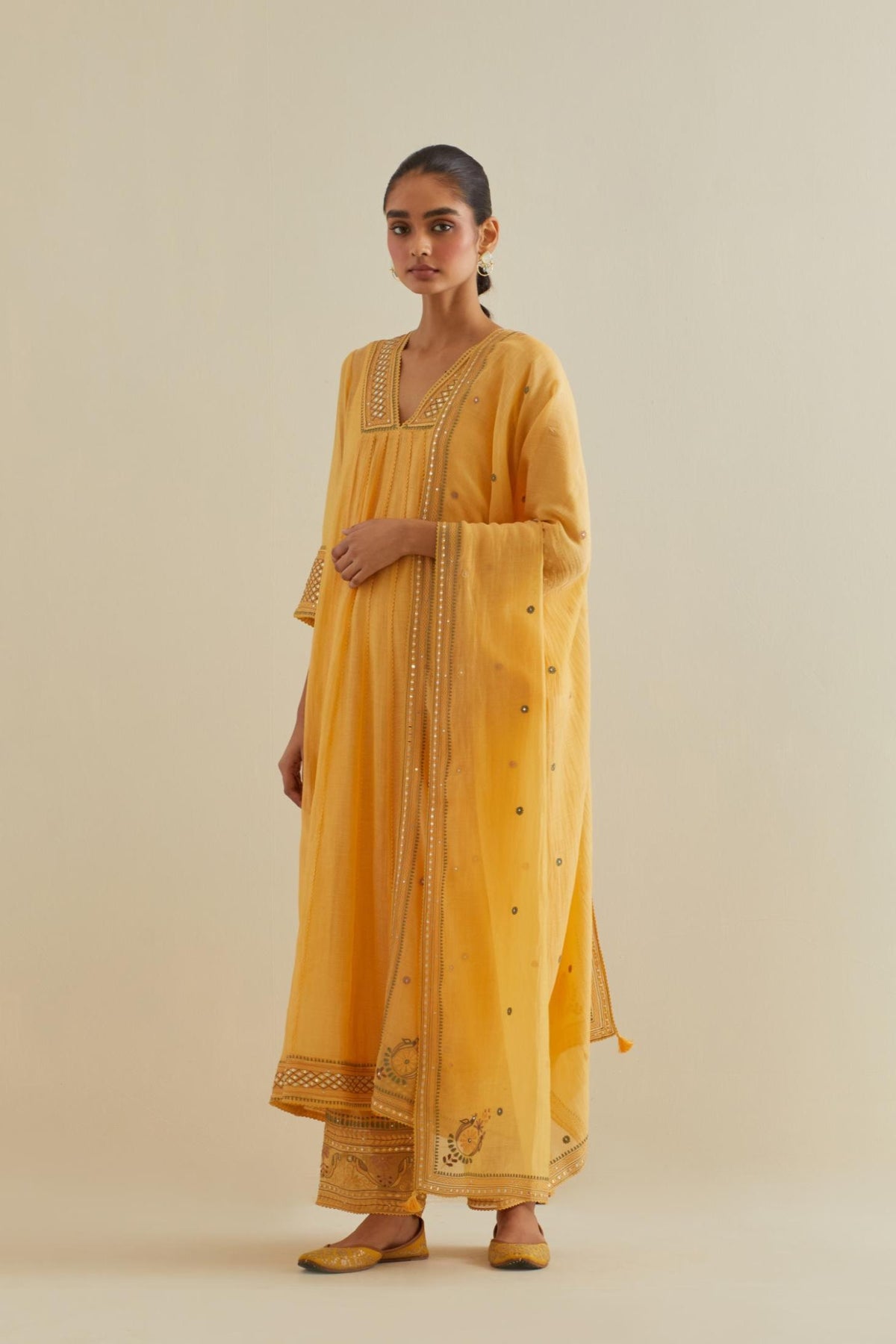 Yellow cotton chanderi kurta dress set with a V neck embroidered yoke and panels.