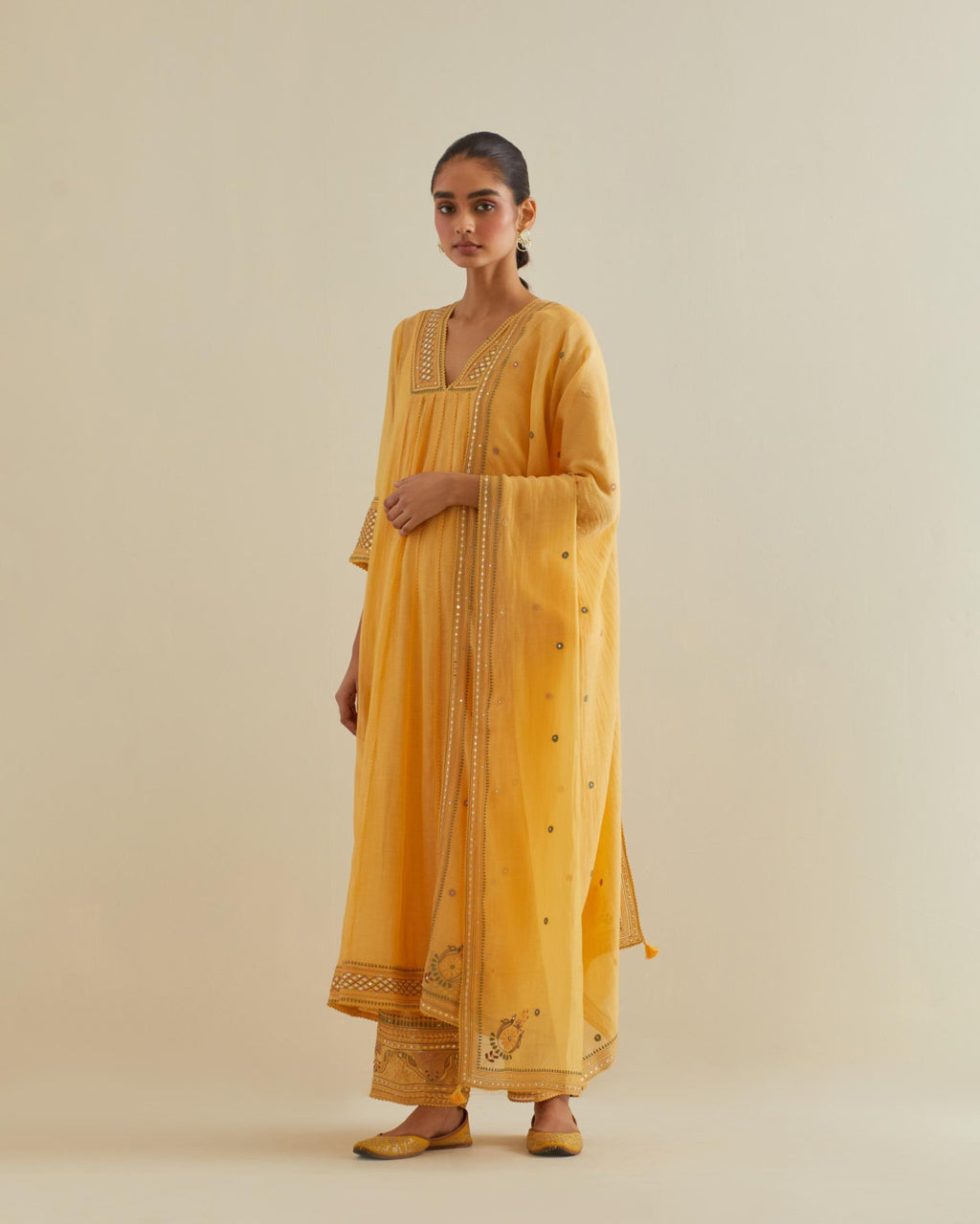 Yellow cotton chanderi kurta dress set with a V neck embroidered yoke and panels.